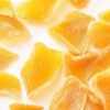 dried mango slices: a frame made from dried mango slices, scattered naturally over a soft white background, the vibrant orange hues of the fruit create a lively, tropical feel