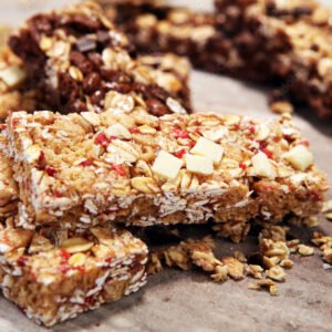 Granola bar. Healthy sweet dessert snack. Cereal granola bar with nuts, fruit and berries